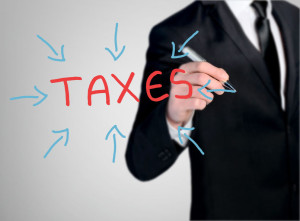 45899099 - business man close-up write taxes word