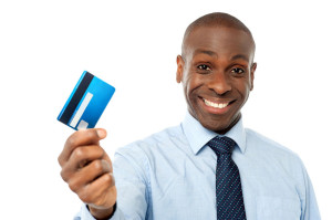 28481893 - smiling corporate man showing his debit card